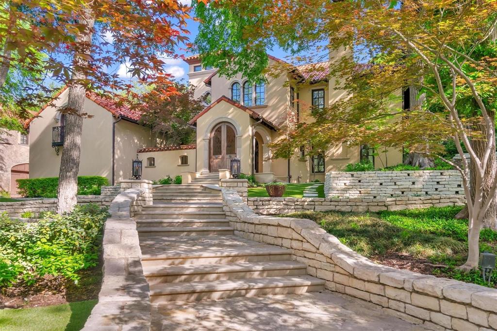 4612 Watauga Road Dallas, TX 75209 - Photo 2 of 32 The property features an inviting stone staircase leading to the main entrance, complemented by stone retaining walls