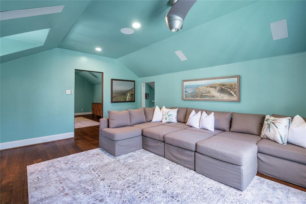 4612 Watauga Road Dallas, TX 75209 - Photo 25 of 32 This living area features a vaulted ceiling with recessed lighting and a ceiling fan