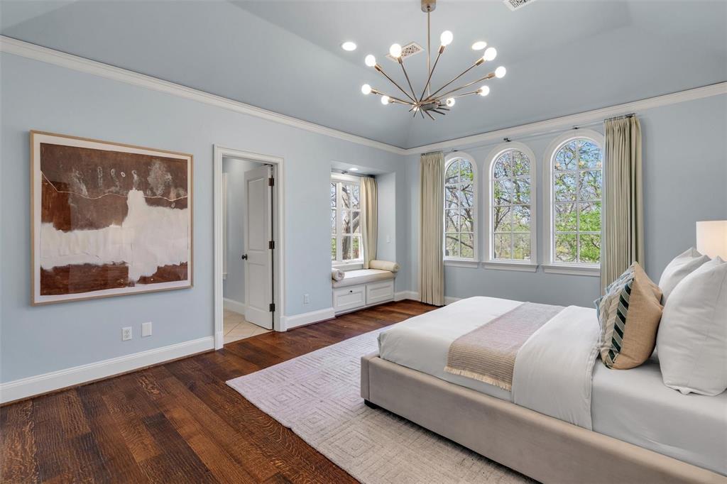 4612 Watauga Road Dallas, TX 75209 - Photo 29 of 32 This room features dark hardwood floors, light blue walls, and a light blue ceiling with crown molding