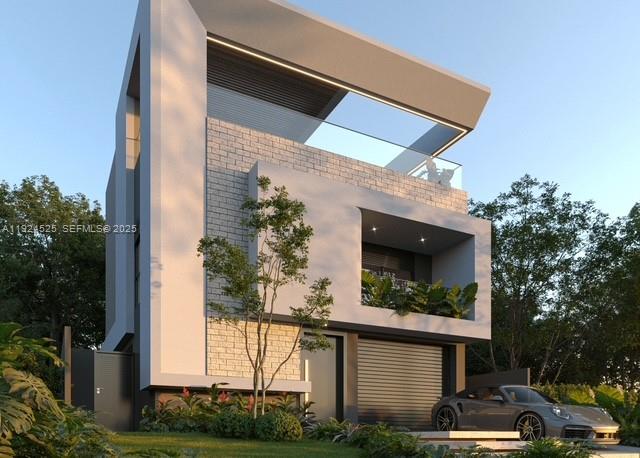 349 Walnut Street Hollywood, FL 33019 - Photo 2 of 3 a front view of a house with garden