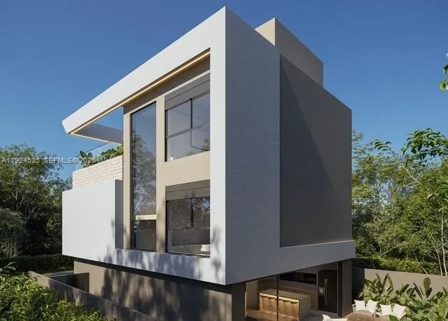 a front view of a house with plants