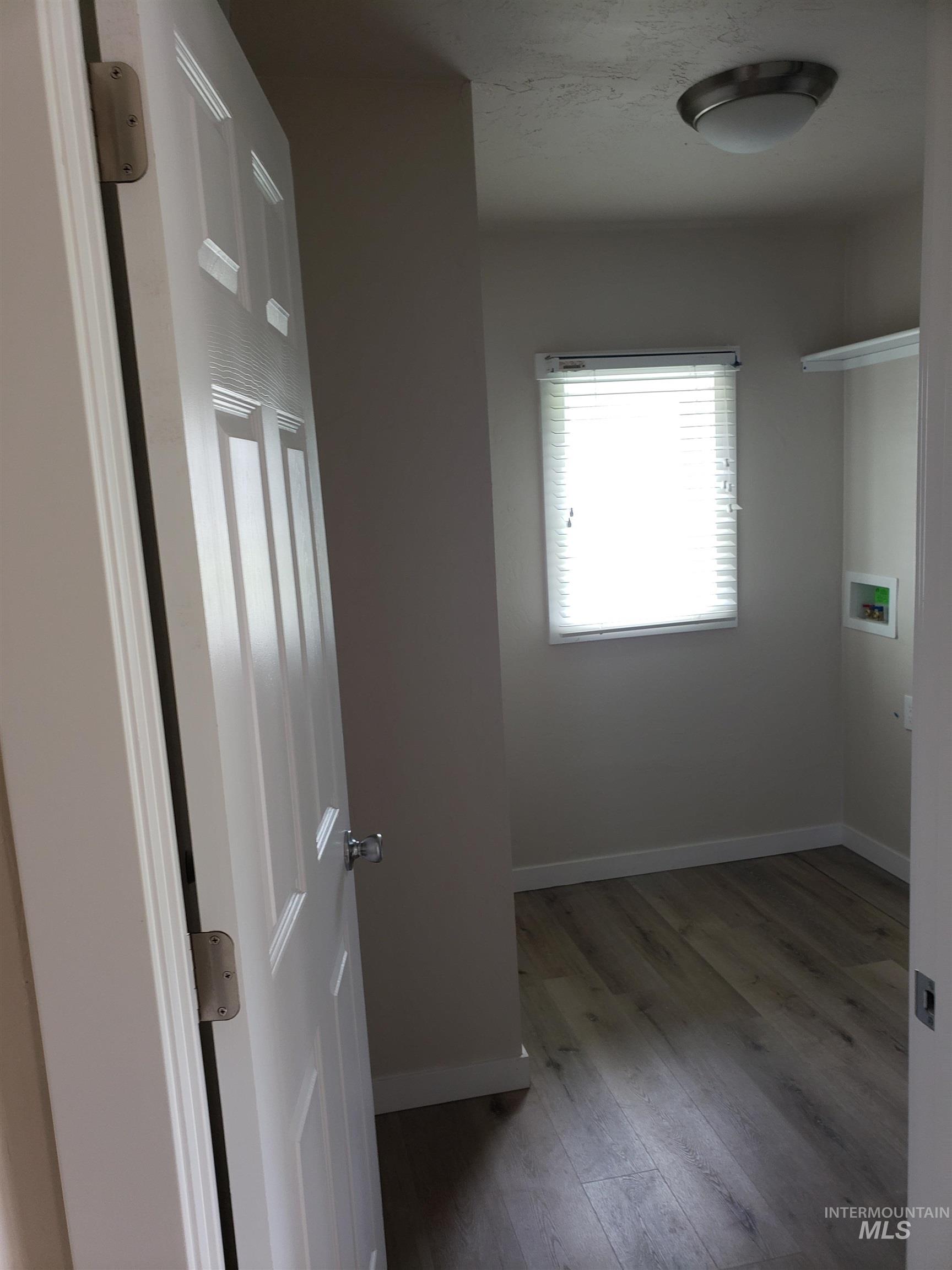131 Patton Street Marsing, ID 83639 - Photo 24 of 26 Laundry room featuring light wood finished floors and washer hookup