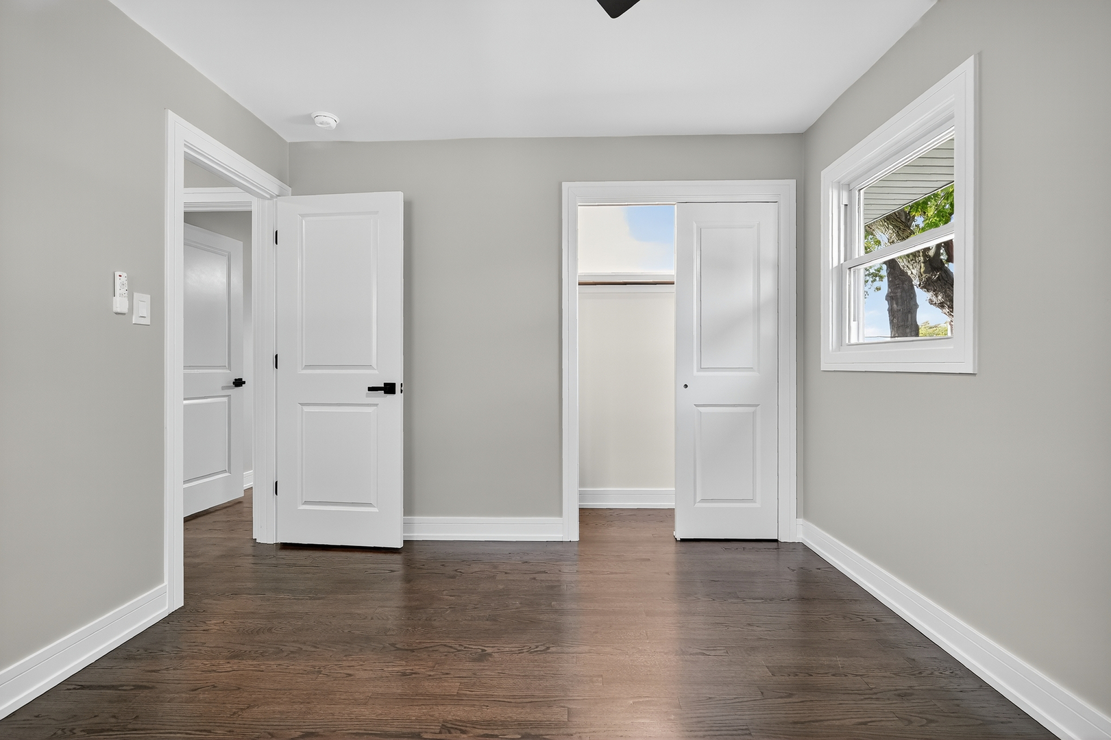 3540 Madison Street Lansing, IL 60438 - Photo 16 of 29 an empty room with wooden floor and window