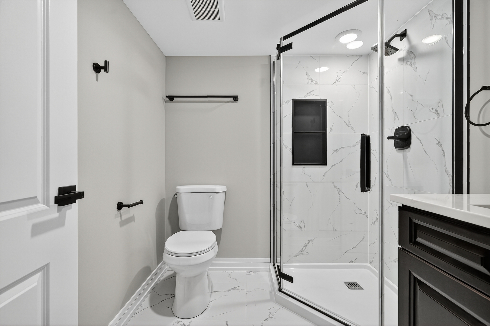 3540 Madison Street Lansing, IL 60438 - Photo 20 of 29 a bathroom with a granite countertop sink a toilet and shower