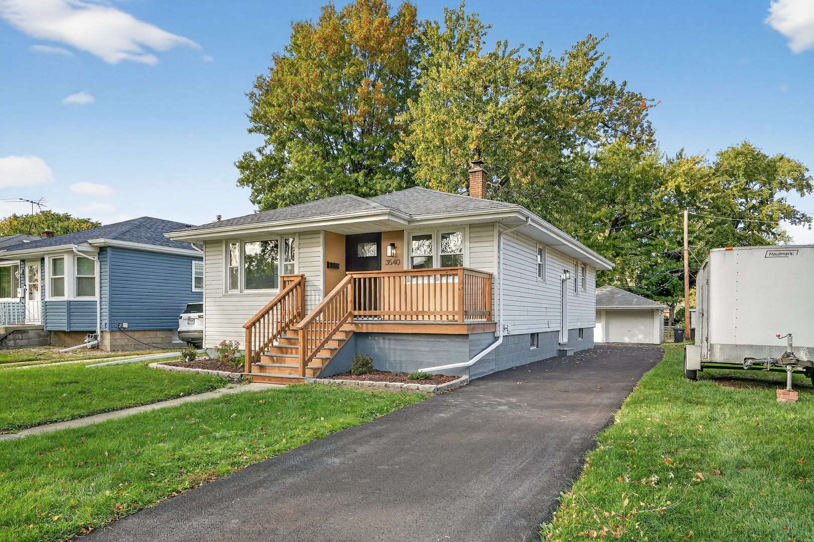 3540 Madison Street Lansing, IL 60438 - Photo 2 of 29 a view of a house with a yard and sitting area