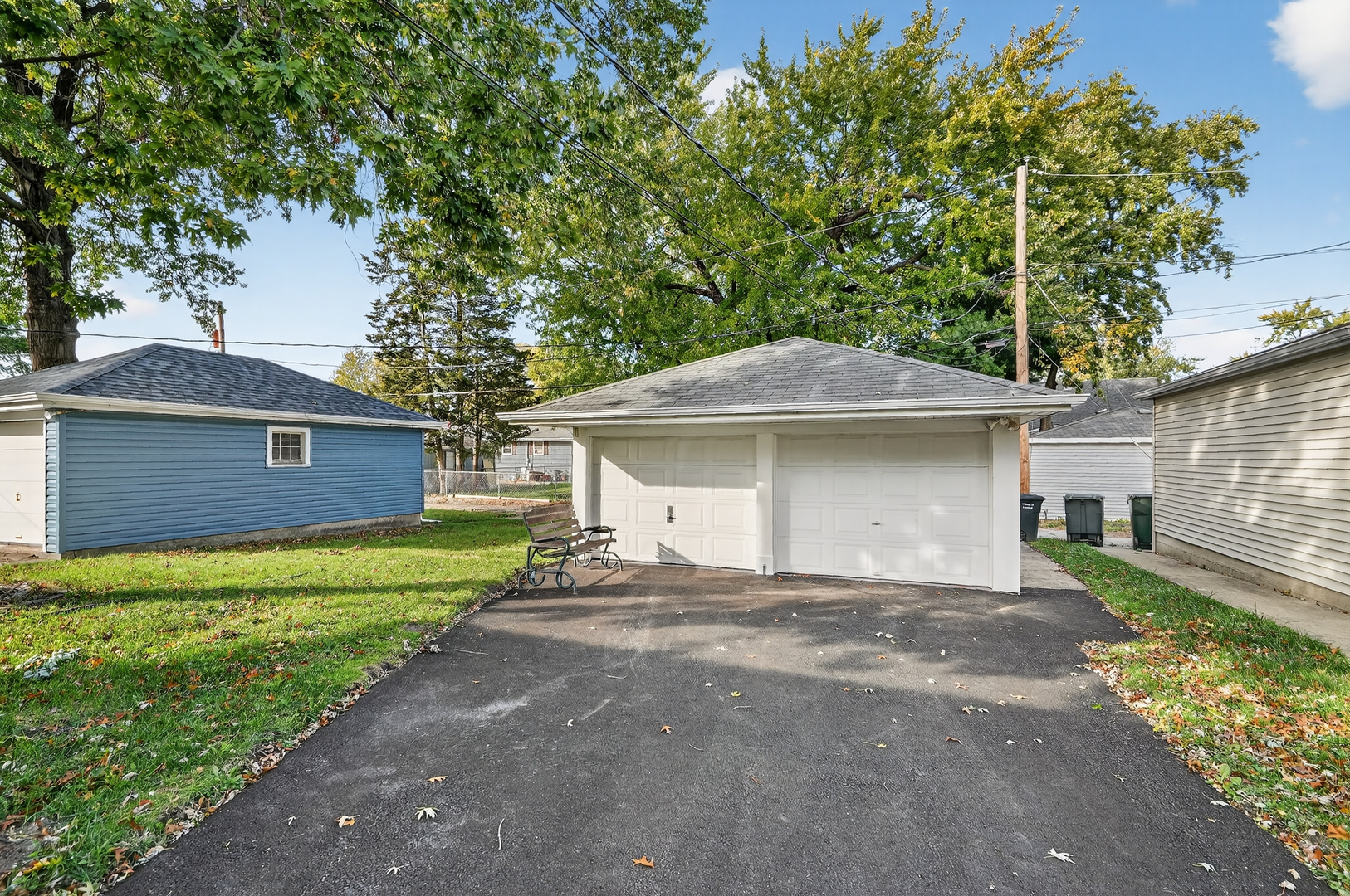 3540 Madison Street Lansing, IL 60438 - Photo 28 of 29 a front view of a house with a yard and garage