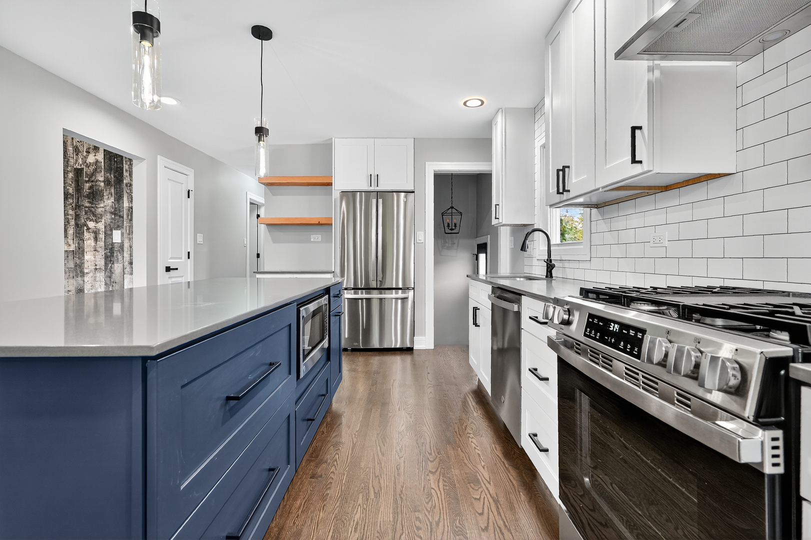 3540 Madison Street Lansing, IL 60438 - Photo 6 of 29 a kitchen with stainless steel appliances a sink stove and refrigerator
