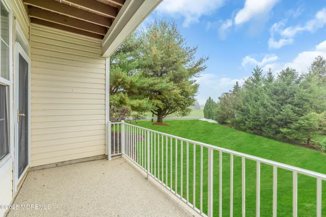 a view of a balcony with an outdoor space