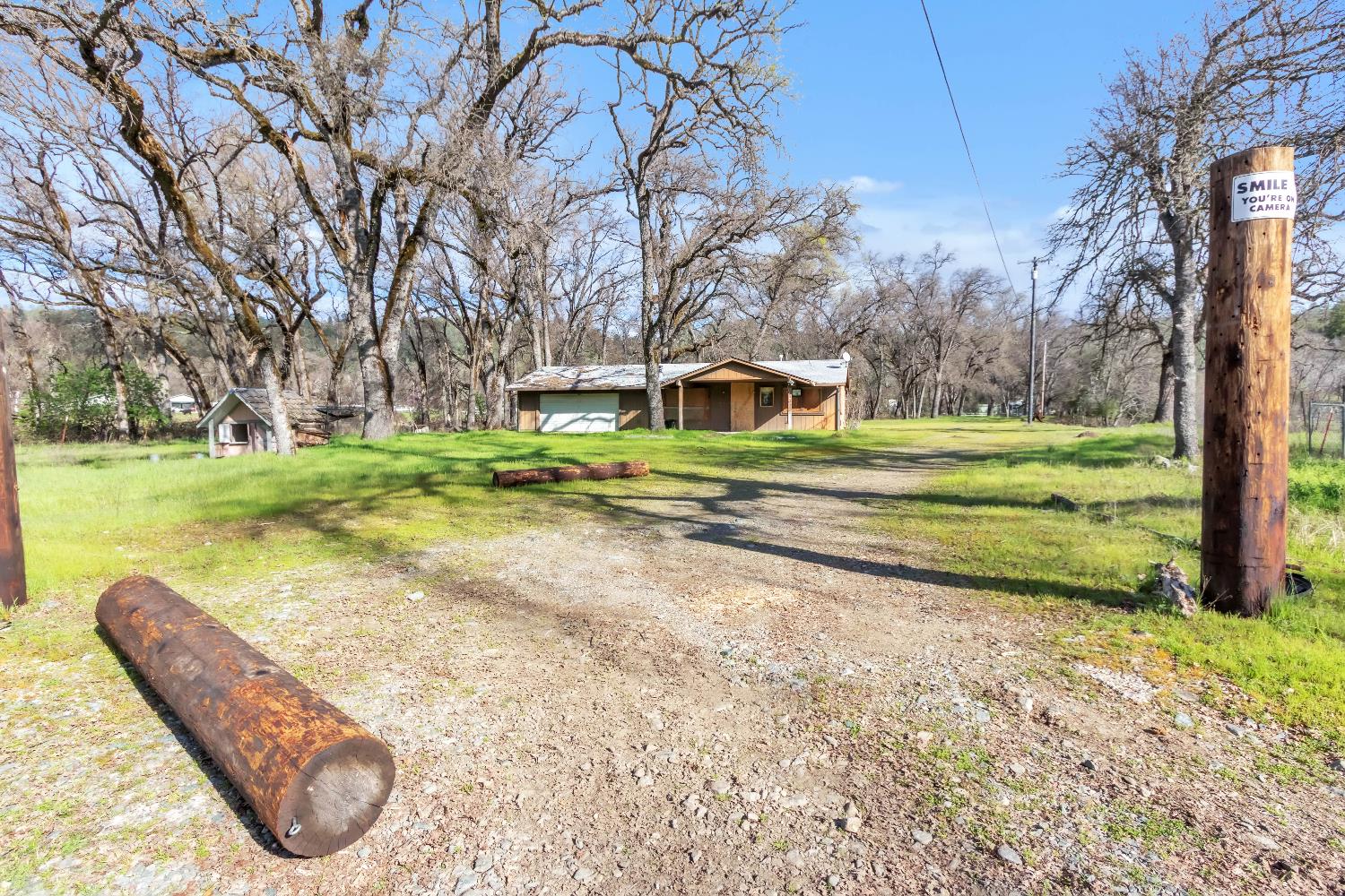 a view of a house with a yard and sitting area