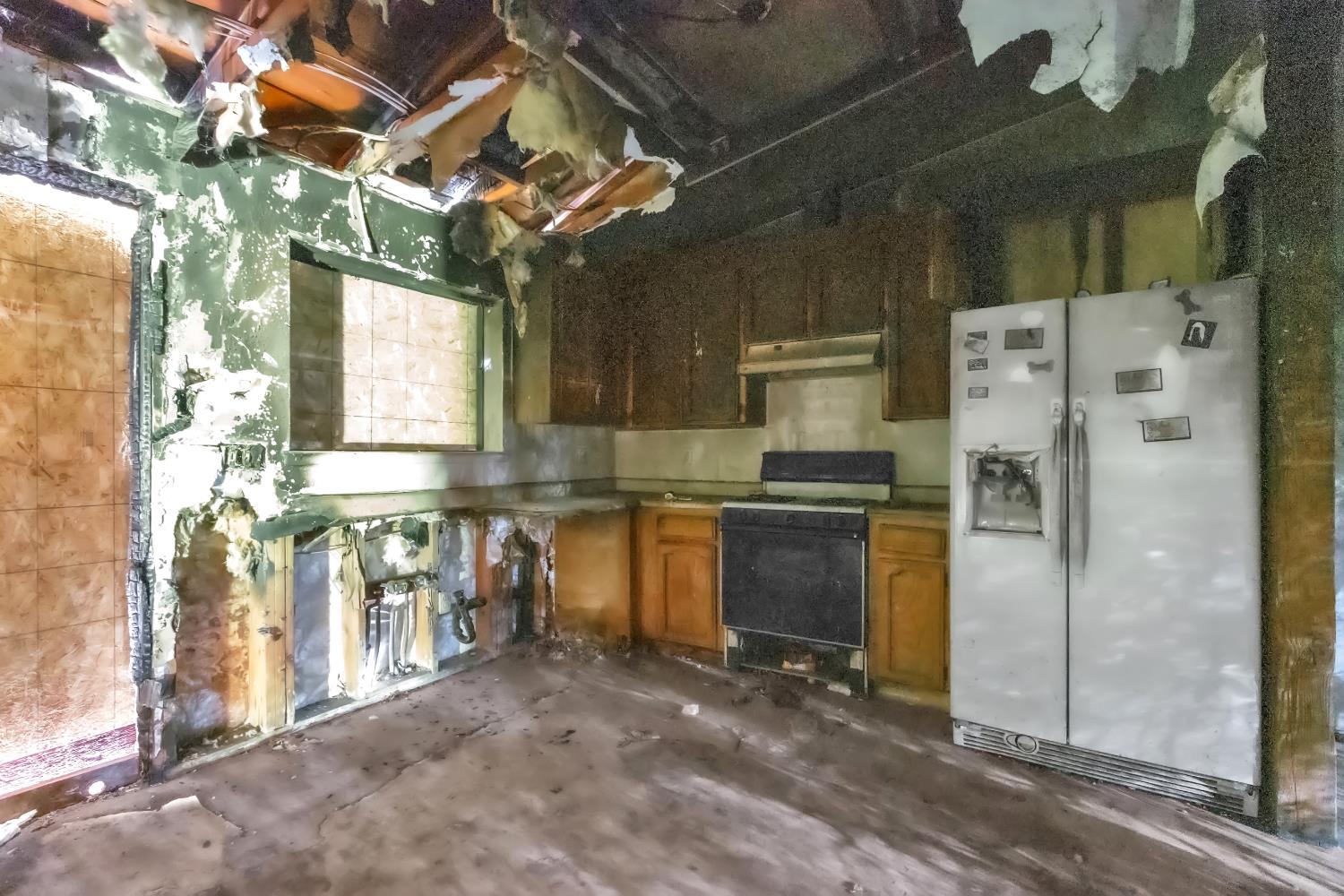 10121 Valley Drive Rough and Ready, CA 95975 - Photo 37 of 44 a kitchen with a refrigerator and a sink
