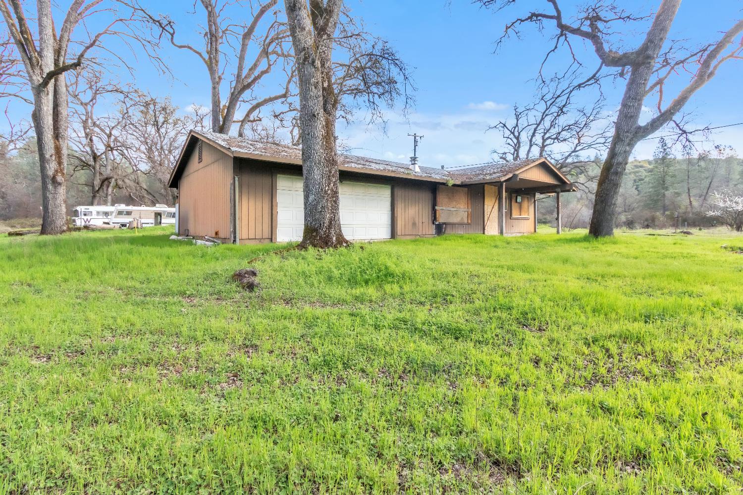 10121 Valley Drive Rough and Ready, CA 95975 - Photo 4 of 44 a house view with a garden space