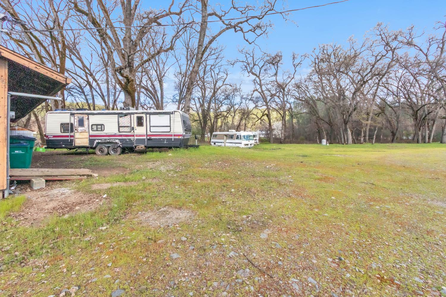 10121 Valley Drive Rough and Ready, CA 95975 - Photo 5 of 44 a view of a yard with a house in the background