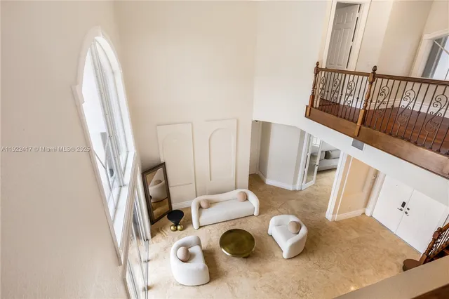 a view of living room with furniture and a flat screen tv