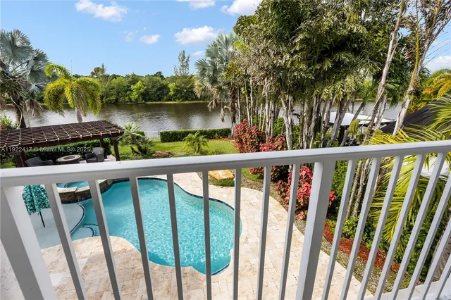 a view of a wooden deck and lake