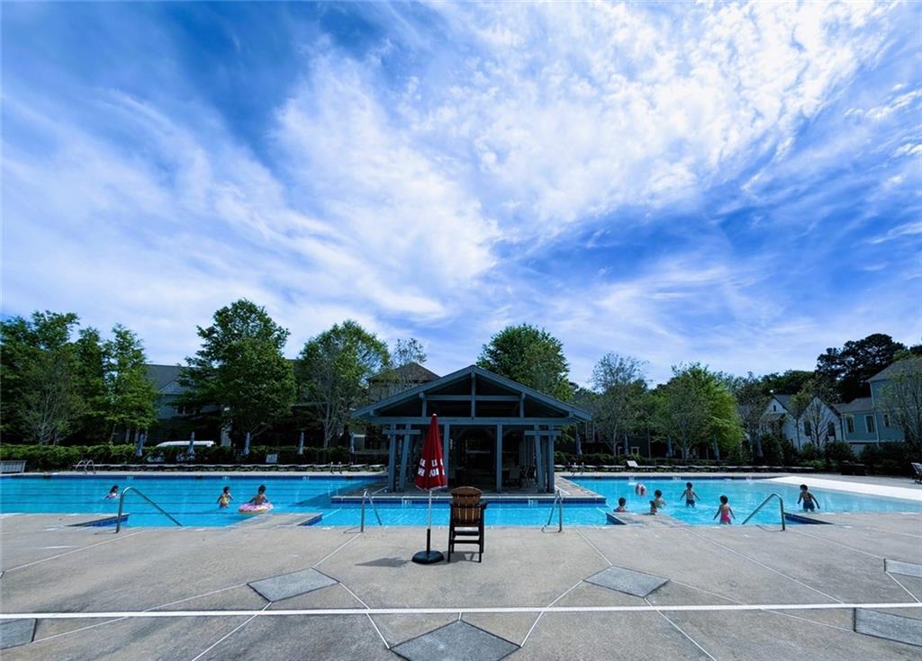 360 Chambers Street, Unit 208 Woodstock, GA 30188 - Photo 13 of 46 a view of a park with swings and slides