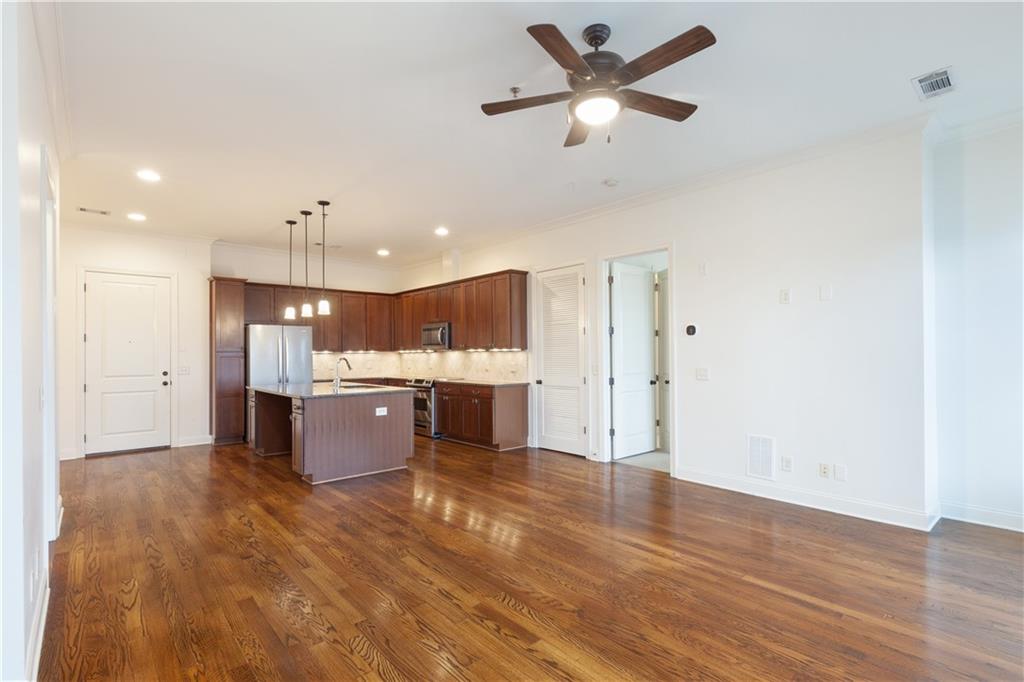 360 Chambers Street, Unit 208 Woodstock, GA 30188 - Photo 15 of 46 a view of kitchen with wooden floor and window