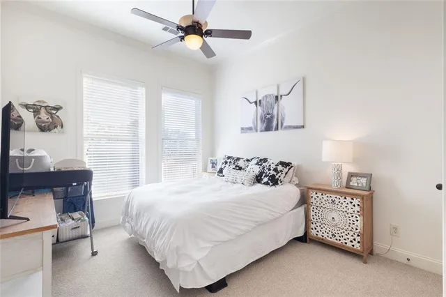 a bedroom with a bed and a table