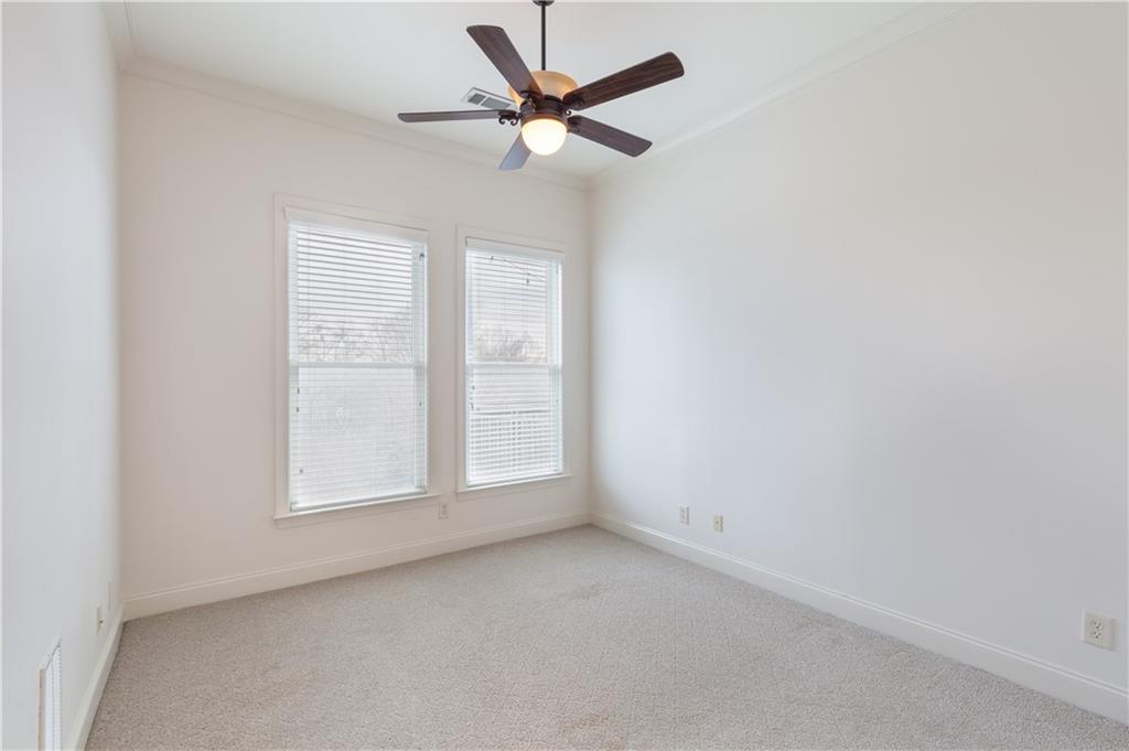 360 Chambers Street, Unit 208 Woodstock, GA 30188 - Photo 24 of 46 an empty room with a window and a fan