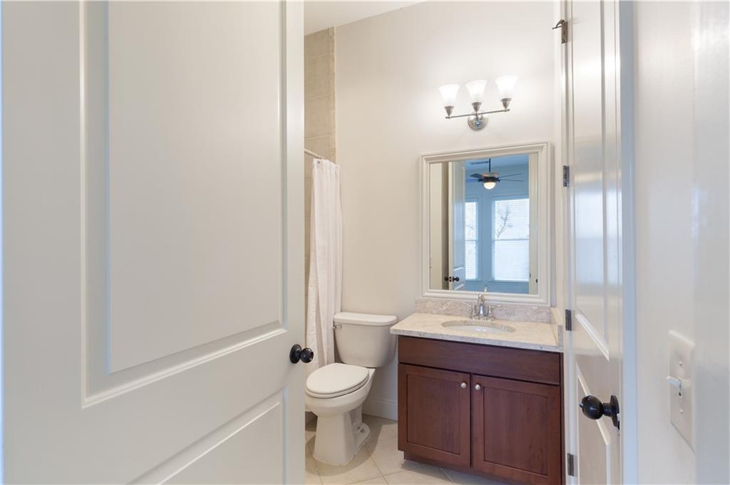360 Chambers Street, Unit 208 Woodstock, GA 30188 - Photo 26 of 46 a bathroom with a sink a toilet and shower