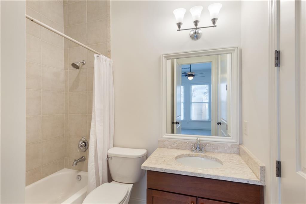 360 Chambers Street, Unit 208 Woodstock, GA 30188 - Photo 27 of 46 a bathroom with a sink toilet and shower