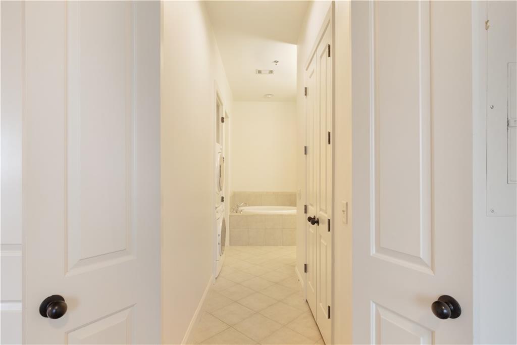 360 Chambers Street, Unit 208 Woodstock, GA 30188 - Photo 31 of 46 a bathroom with a glass shower door