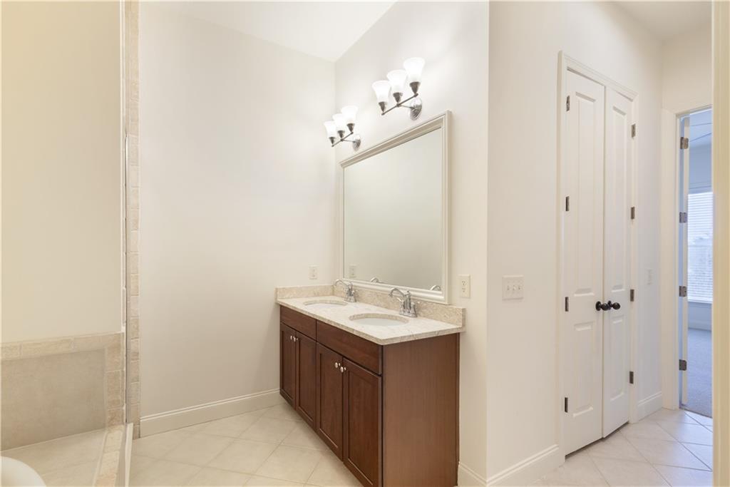 360 Chambers Street, Unit 208 Woodstock, GA 30188 - Photo 33 of 46 a bathroom with a sink and a mirror