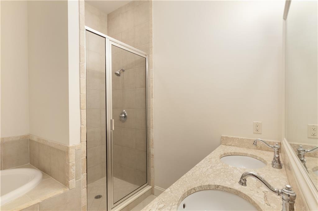 360 Chambers Street, Unit 208 Woodstock, GA 30188 - Photo 34 of 46 a bathroom with a granite countertop sink and toilet
