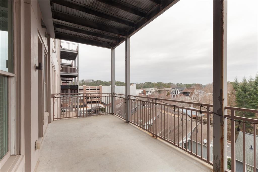 360 Chambers Street, Unit 208 Woodstock, GA 30188 - Photo 37 of 46 a view of a balcony with city