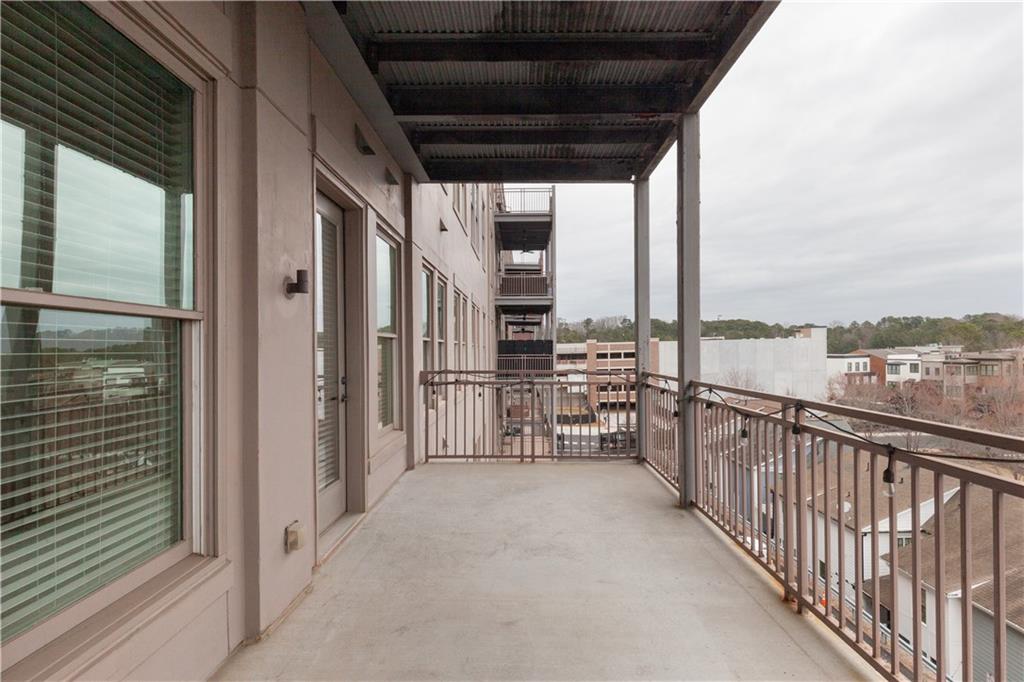 360 Chambers Street, Unit 208 Woodstock, GA 30188 - Photo 39 of 46 a view of a balcony with city view