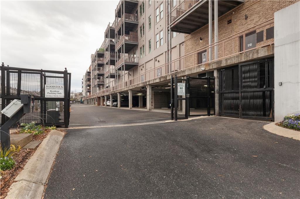 360 Chambers Street, Unit 208 Woodstock, GA 30188 - Photo 42 of 46 a view of a building with a street