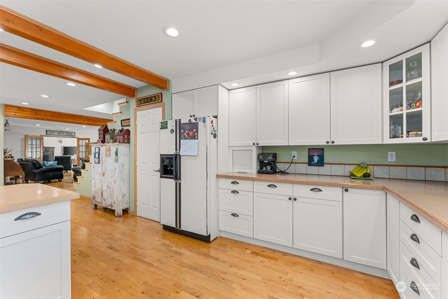 158 Hawkins Road Winlock, WA 98596 - Photo 14 of 28 a kitchen with white cabinets and refrigerator