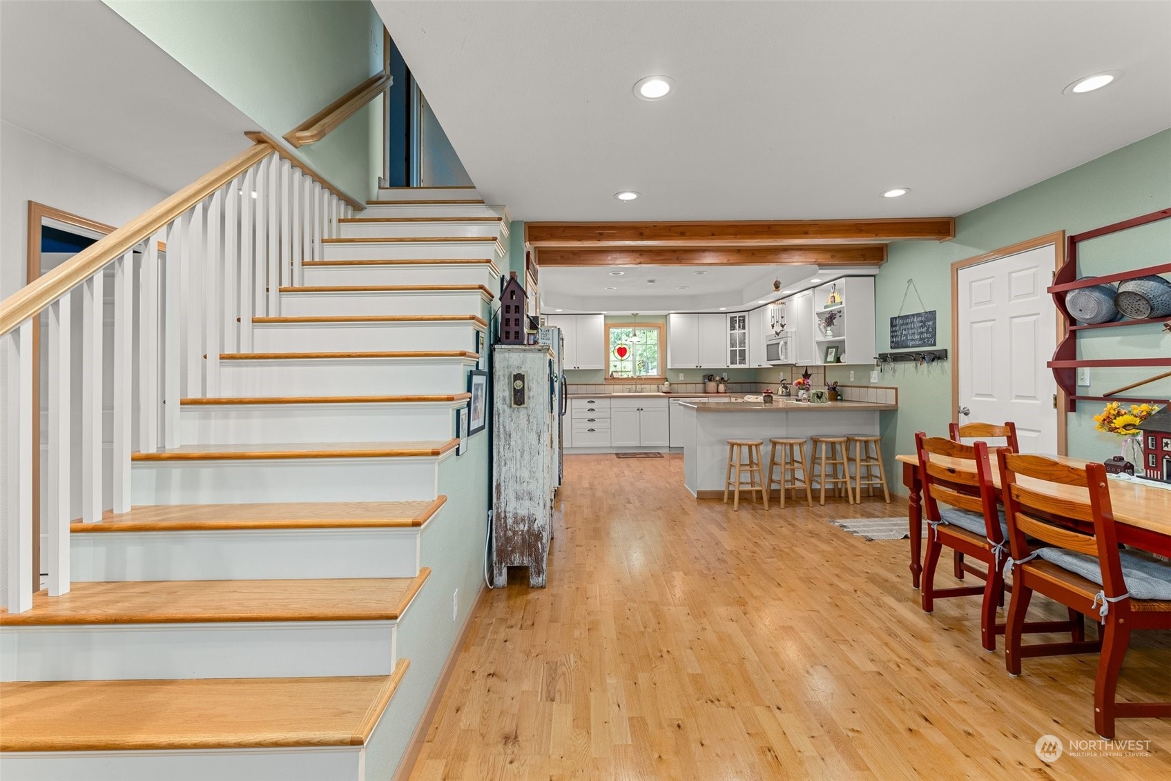158 Hawkins Road Winlock, WA 98596 - Photo 19 of 28 a room with stainless steel appliances lots of wooden furniture and stairs