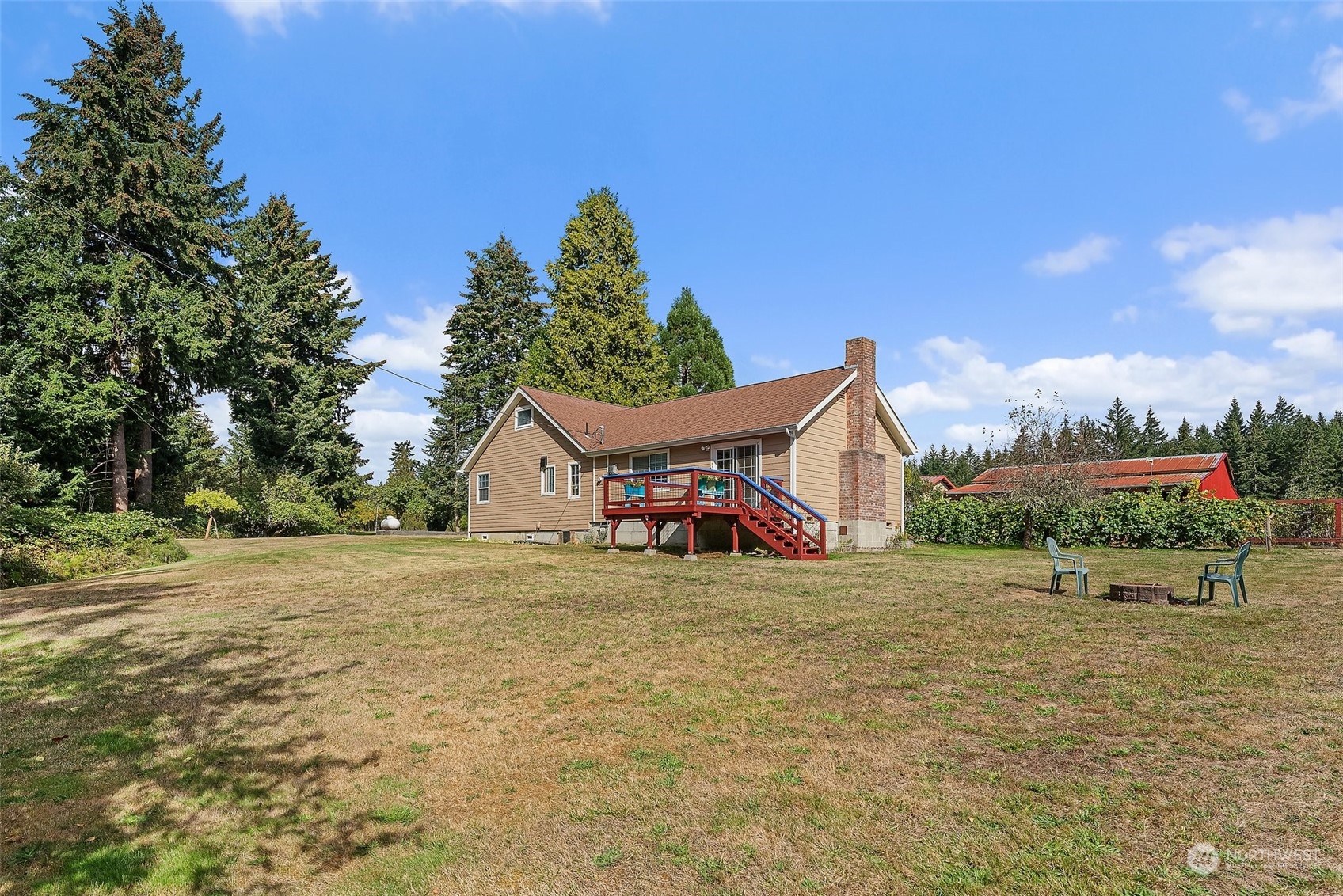 158 Hawkins Road Winlock, WA 98596 - Photo 4 of 28 a backyard of a house with table and chairs