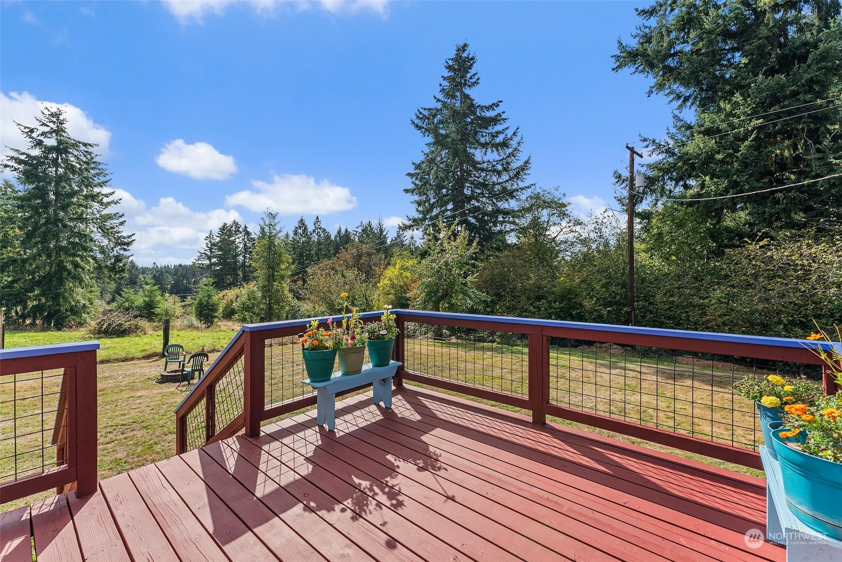 158 Hawkins Road Winlock, WA 98596 - Photo 5 of 28 a view of deck with mountain view and wooden floor