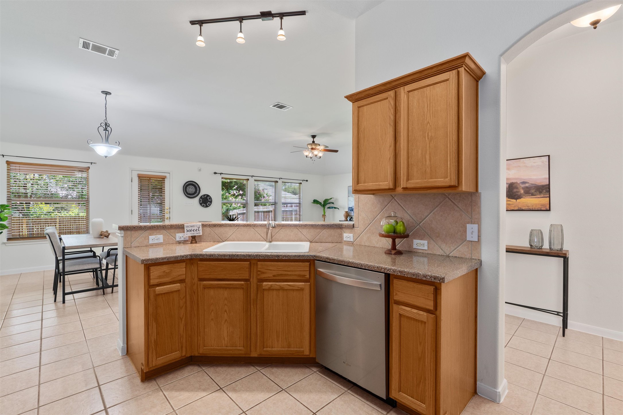 122 Copperwood Loop Round Rock, TX 78665 - Photo 10 of 40 The open-concept kitchen flows directly into the living and dining areas, creating a natural hub for hosting friends or staying connected while preparing meals.