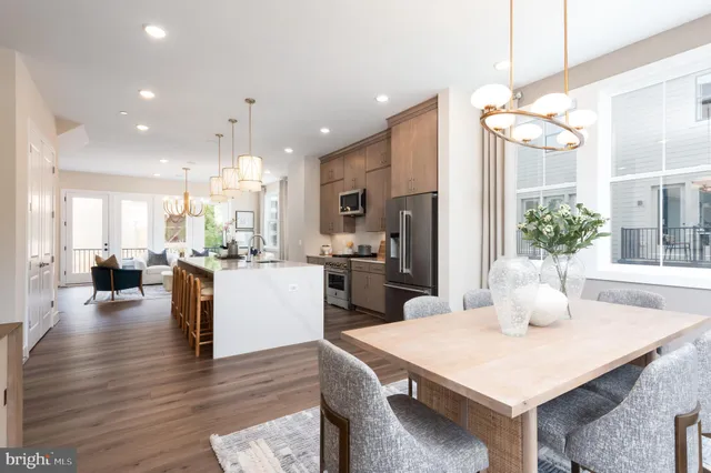a kitchen with a table and chairs