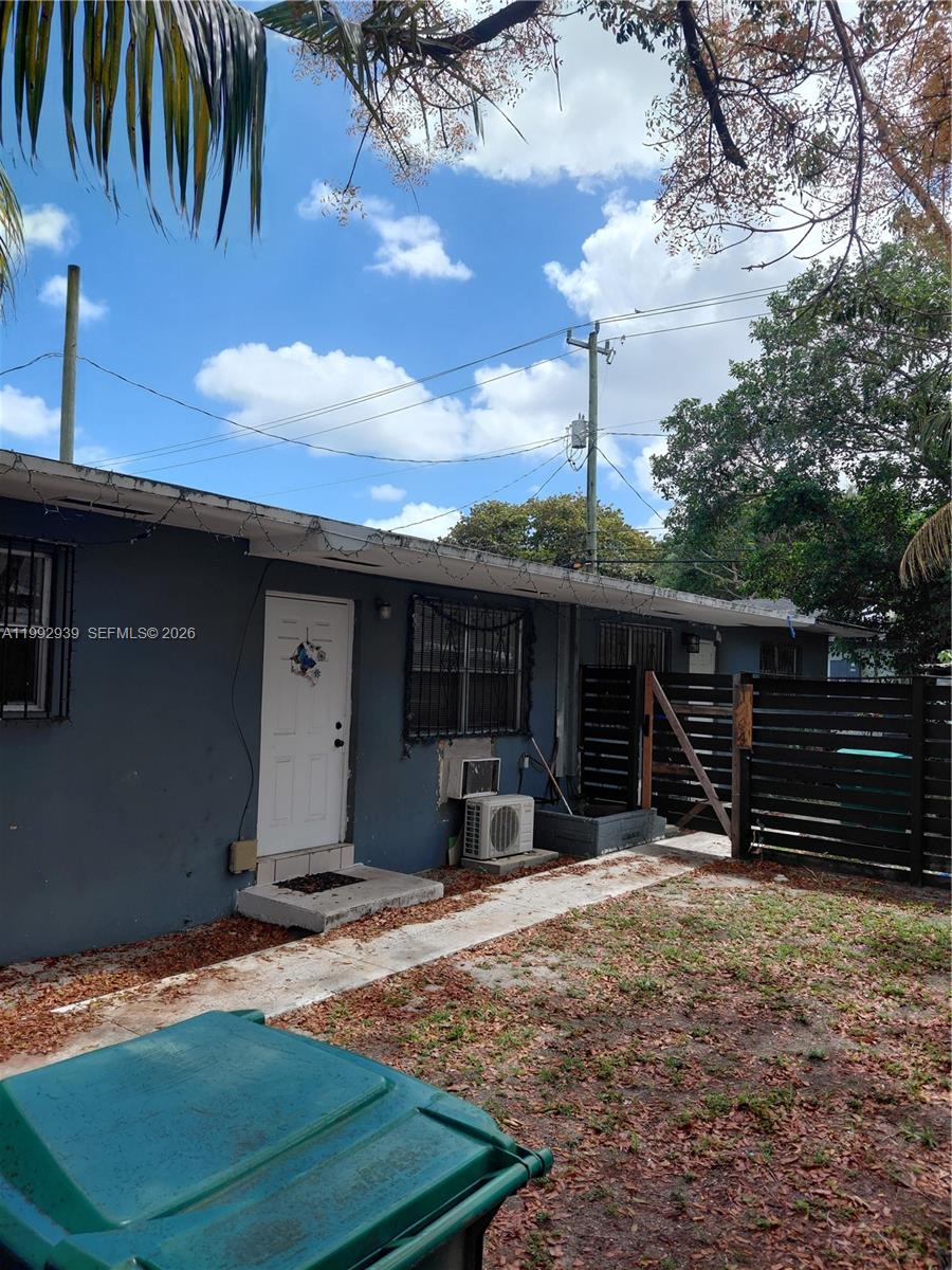 1262-1264 Northwest 46th Street Miami, FL 33142 - Photo 2 of 13 a view of a house with backyard and porch