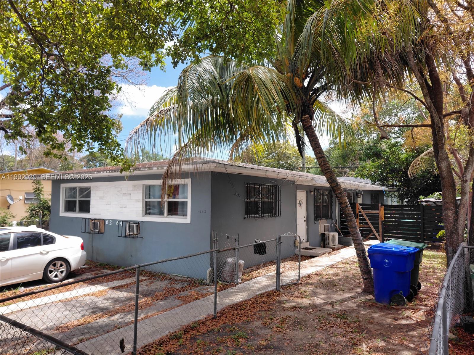 1262-1264 Northwest 46th Street Miami, FL 33142 - Photo 3 of 13 a view of a house with backyard