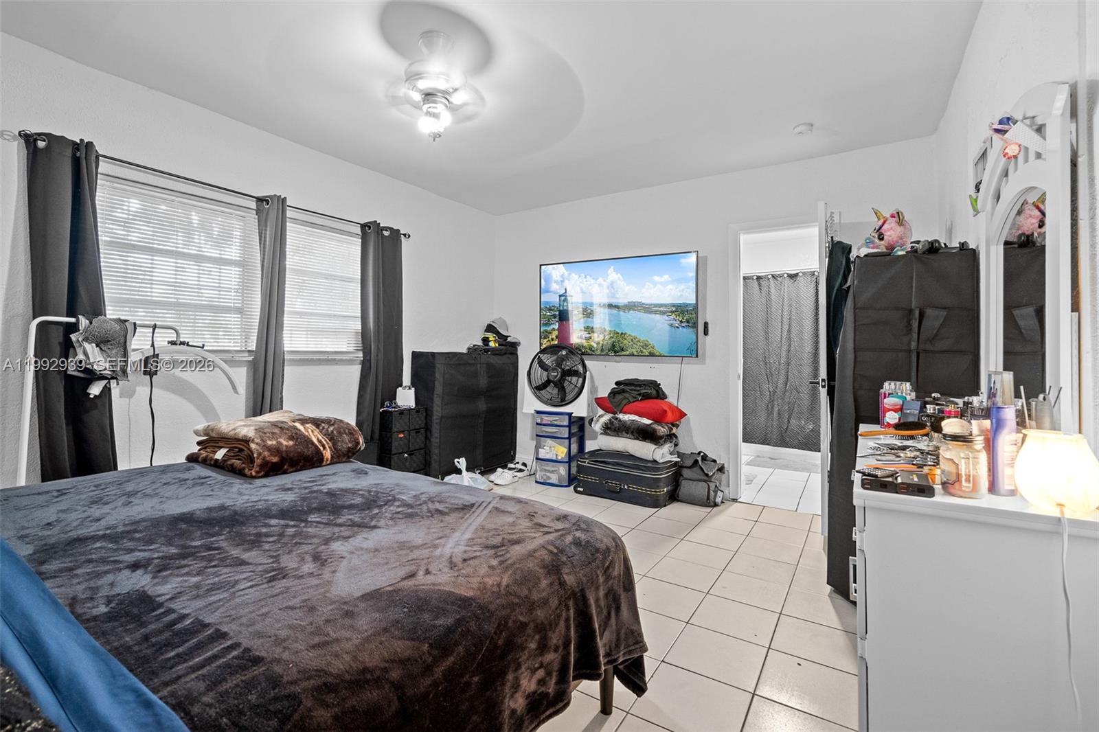 1262-1264 Northwest 46th Street Miami, FL 33142 - Photo 5 of 13 a bedroom with a bed and a closet