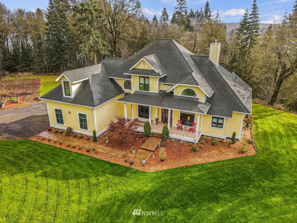 212 Whitewater Road Longview, WA 98632 - Photo 1 of 39 a aerial view of a house next to a big yard and large trees