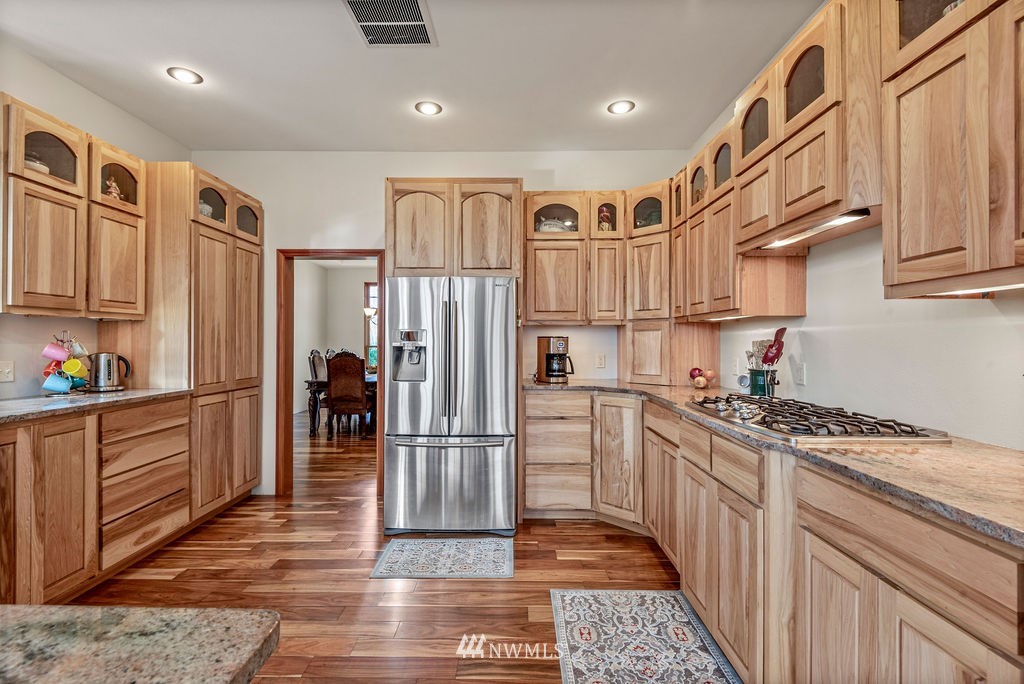 212 Whitewater Road Longview, WA 98632 - Photo 12 of 39 a kitchen with stainless steel appliances granite countertop a refrigerator a stove and a sink
