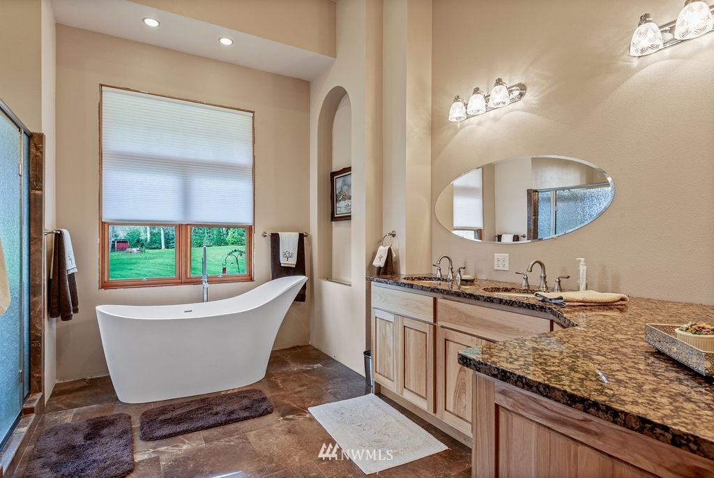 212 Whitewater Road Longview, WA 98632 - Photo 15 of 39 a bathroom with a granite countertop sink and a mirror