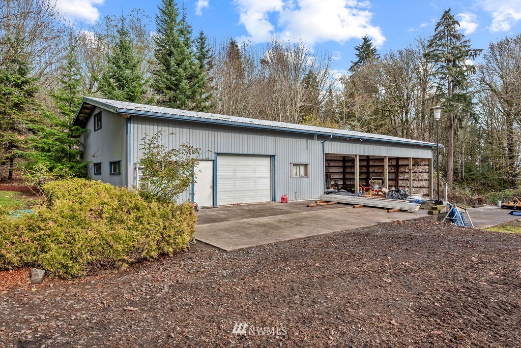 212 Whitewater Road Longview, WA 98632 - Photo 27 of 39 a view of a house with a yard and garage