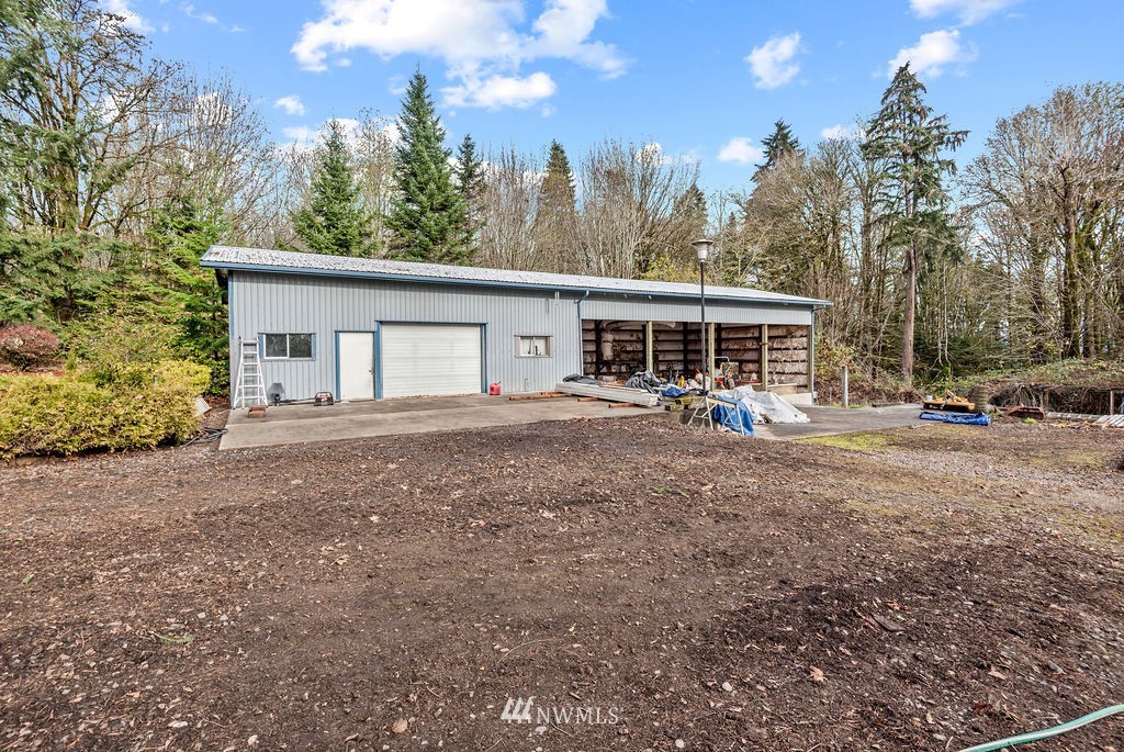 212 Whitewater Road Longview, WA 98632 - Photo 28 of 39 a view of a house with a backyard and sitting area