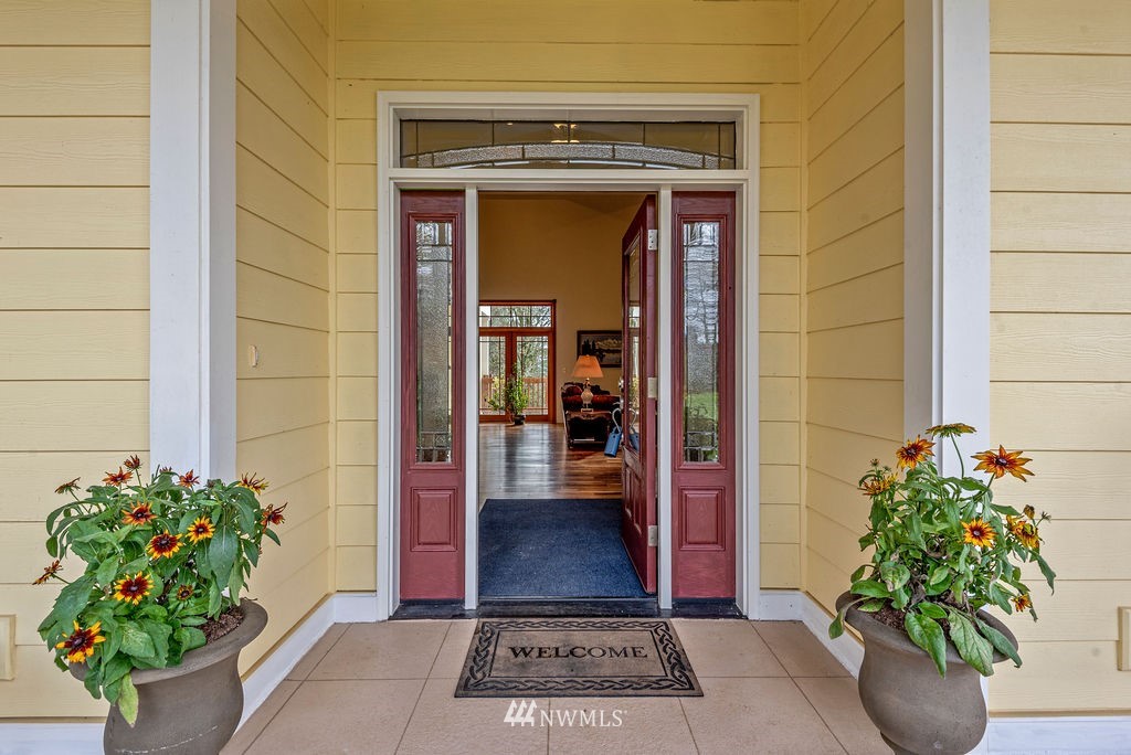 212 Whitewater Road Longview, WA 98632 - Photo 4 of 39 a view of front door of house with potted plant