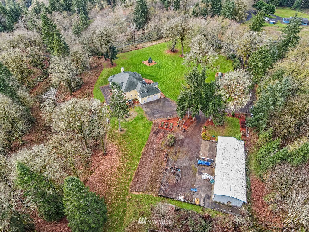 212 Whitewater Road Longview, WA 98632 - Photo 34 of 39 an aerial view of a house with a yard and trees