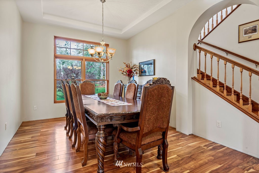 212 Whitewater Road Longview, WA 98632 - Photo 6 of 39 a view of a dining room with furniture window and wooden floor