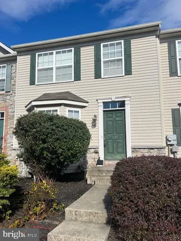 a view of a house with a garden