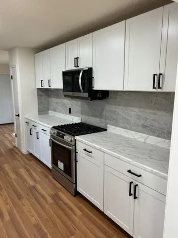 a view of wooden floor and staircase in a room