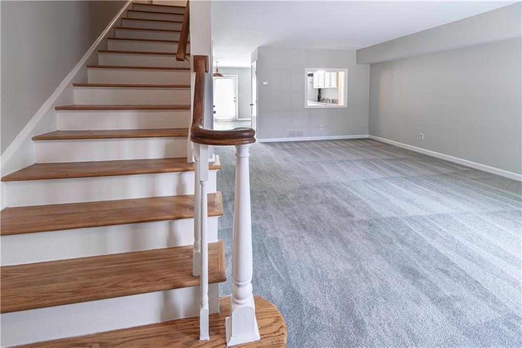 3071 Colonial Way, Unit E Atlanta, GA 30341 - Photo 3 of 16 a view of entryway with wooden floor and windows